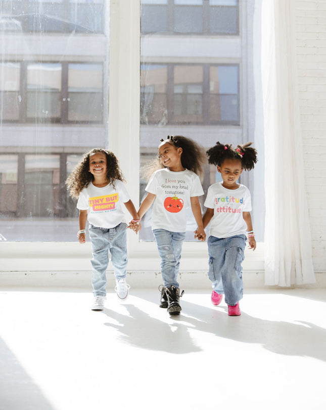 Girl in the middle wearing Tomatoe Tee