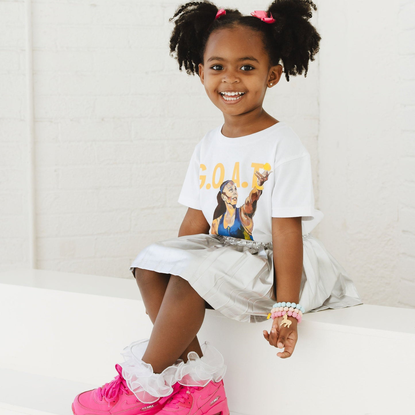 Child wearing GOAT Serena Tee