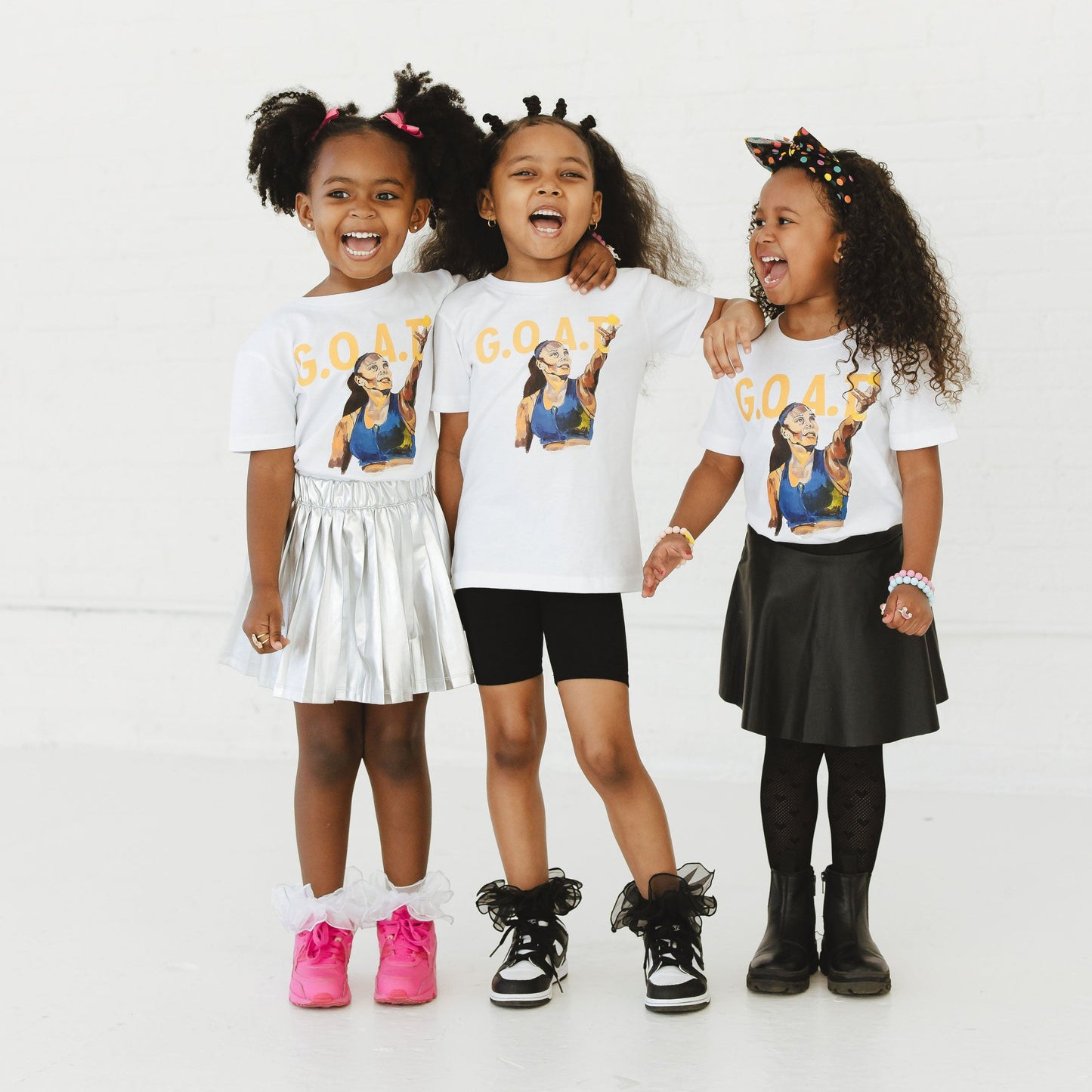 Children wearing GOAT Serena Tees