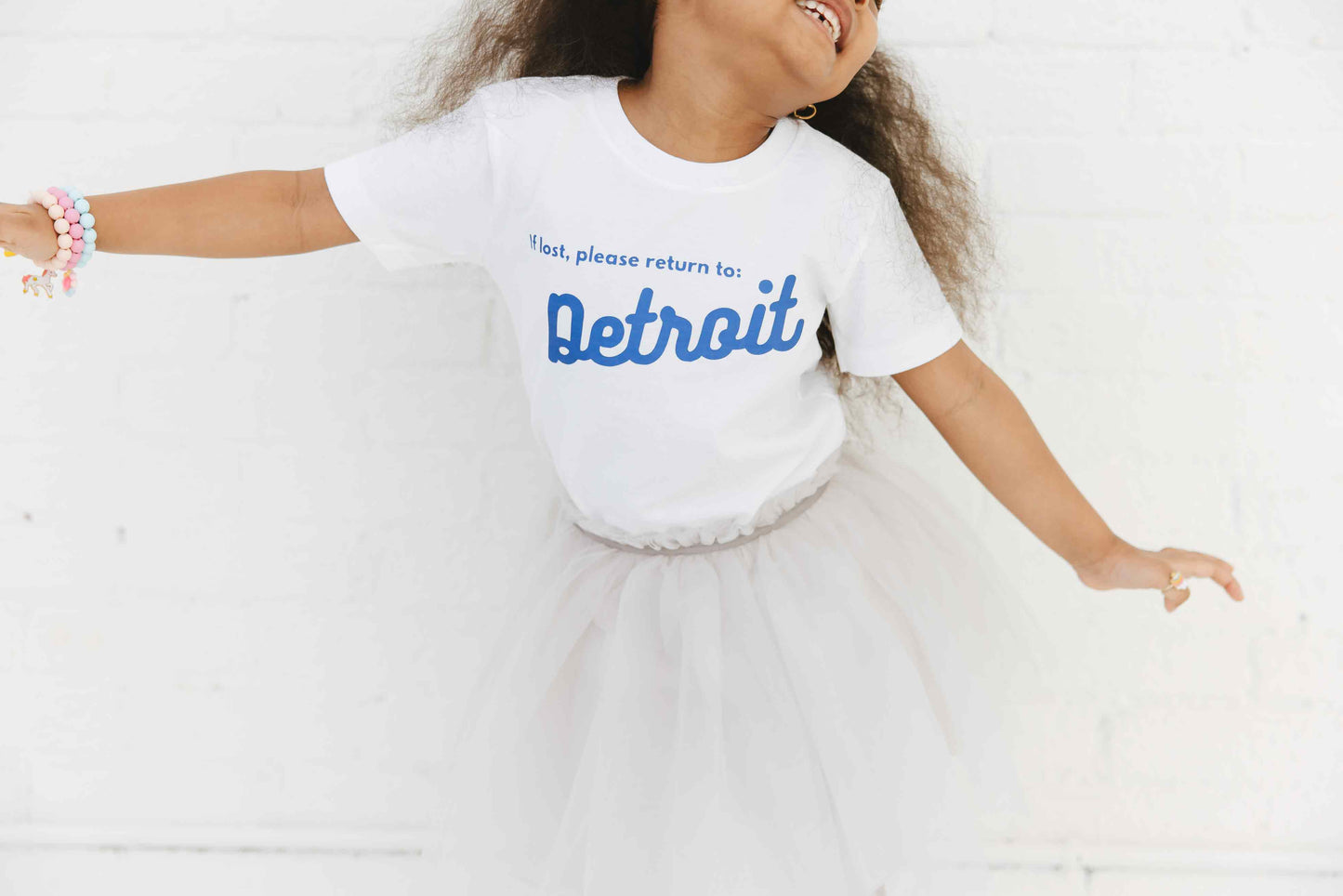 Child wearing If Lost Return to Detroit White Tee