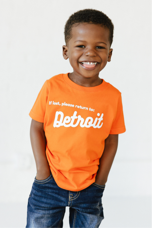 Boy wearing Orange Detroit Tee