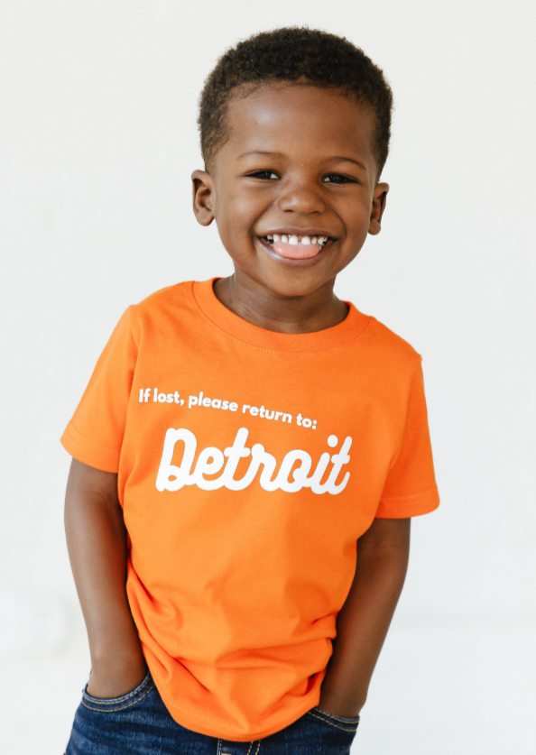 Boy wearing Orange Detroit Tee