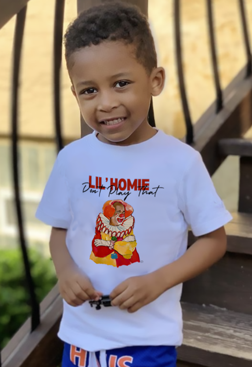 Boy wearing white lil homie tee