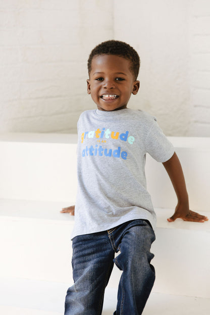 Graphic Tee - Young boy wearing gray gratitude is attitude tee