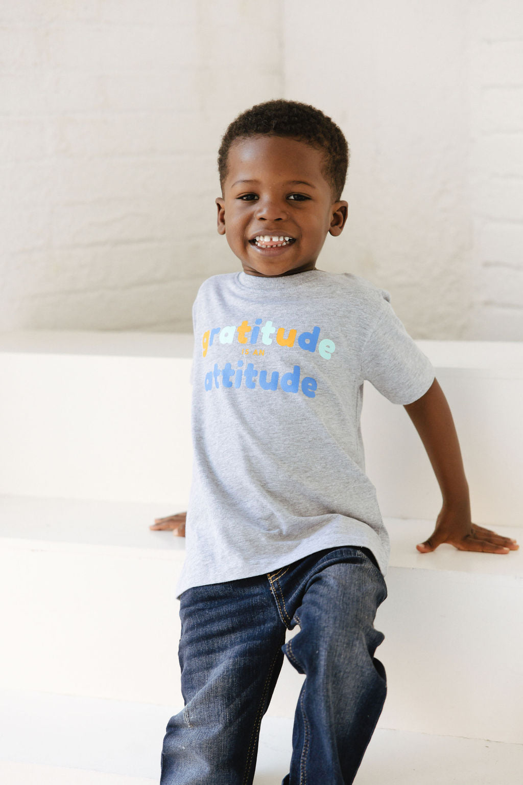 Graphic Tee - Young boy wearing gray gratitude is attitude tee