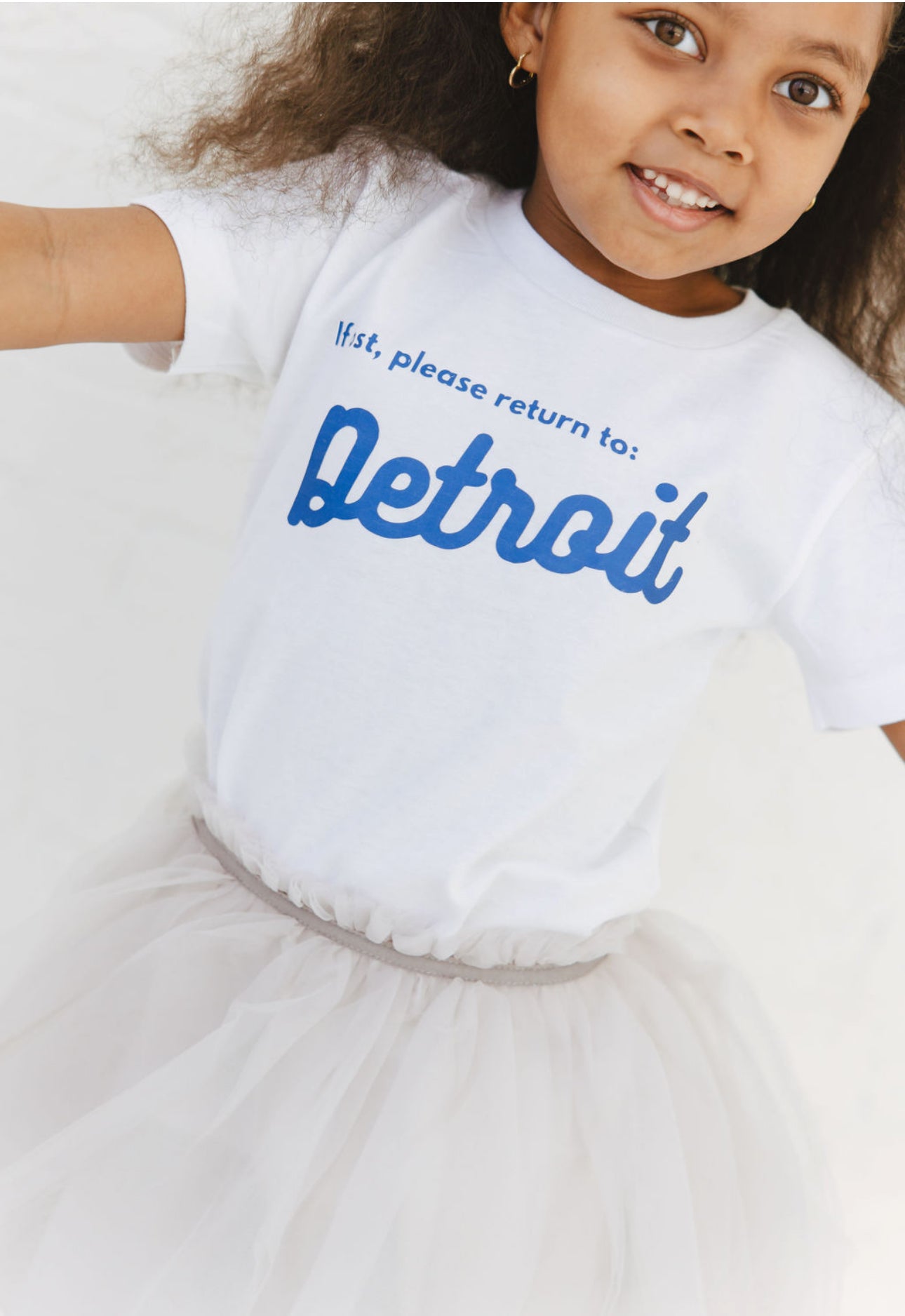 Graphic Tee -Girl wearing White Detroit Tee Closeup