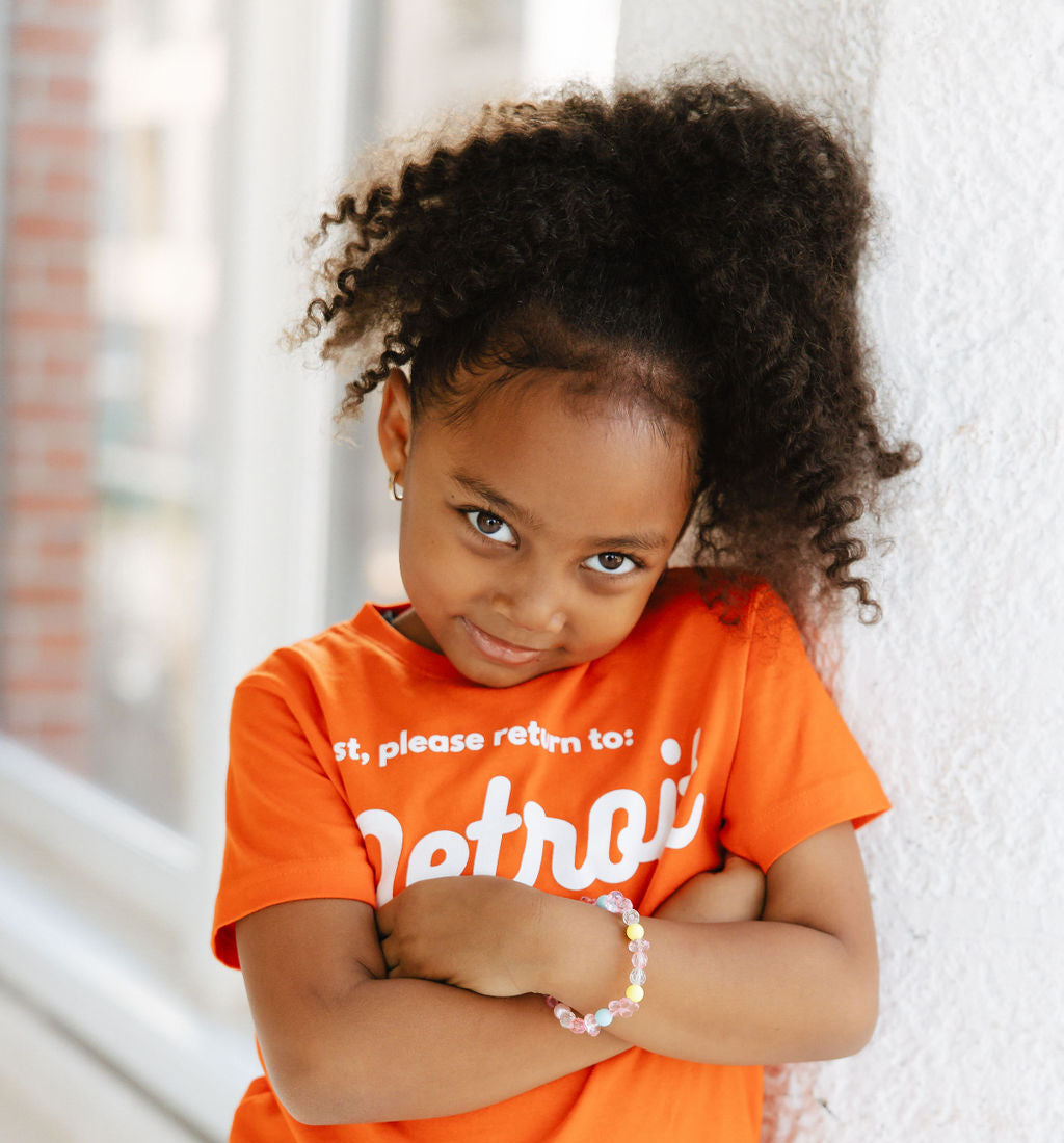 Graphic Tee - Girl wearing Detroit Tee Orange