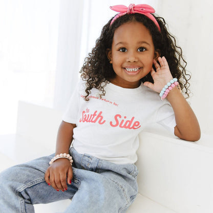 Image of _GIRL_WEARING_WHITE_SOUTHSIDE_TEE_PINK_LETTERS