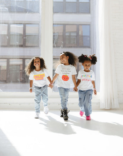 Girl in the middle wearing Tomatoe Tee