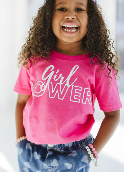 Girl wearing Heliconia Girl Power Tee White Lettering