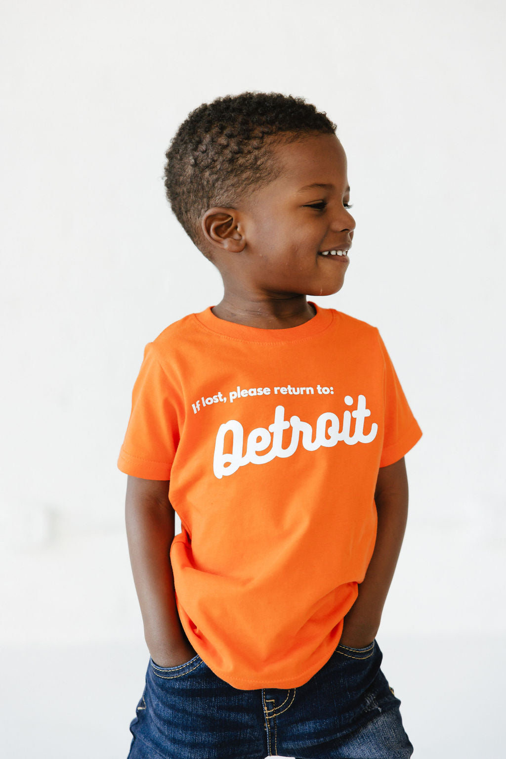 Boy wearing Orange Detroit Tee