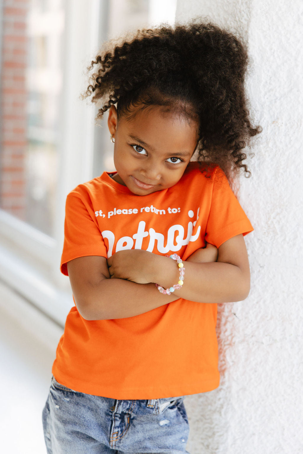 Girl wearing Detroit Tee Orange